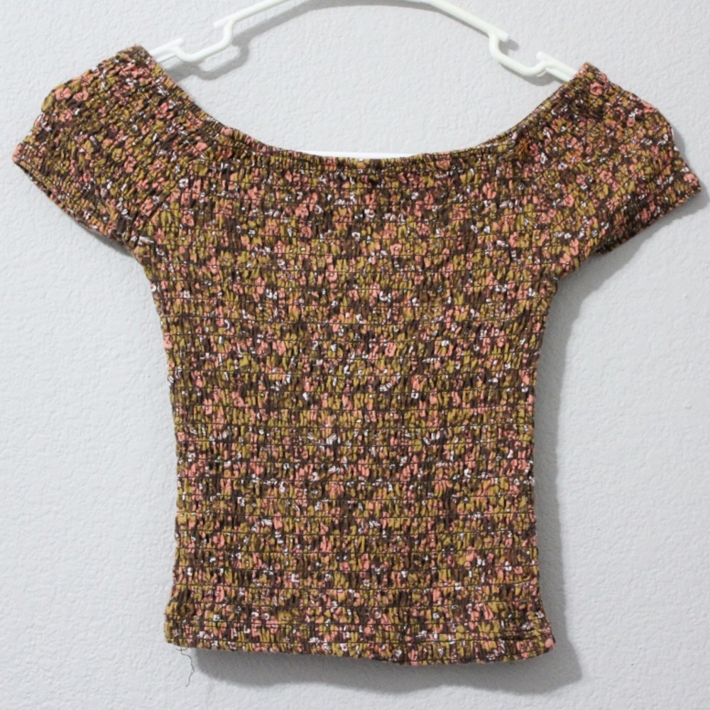 Set of two cap sleeve, patterned blouses.